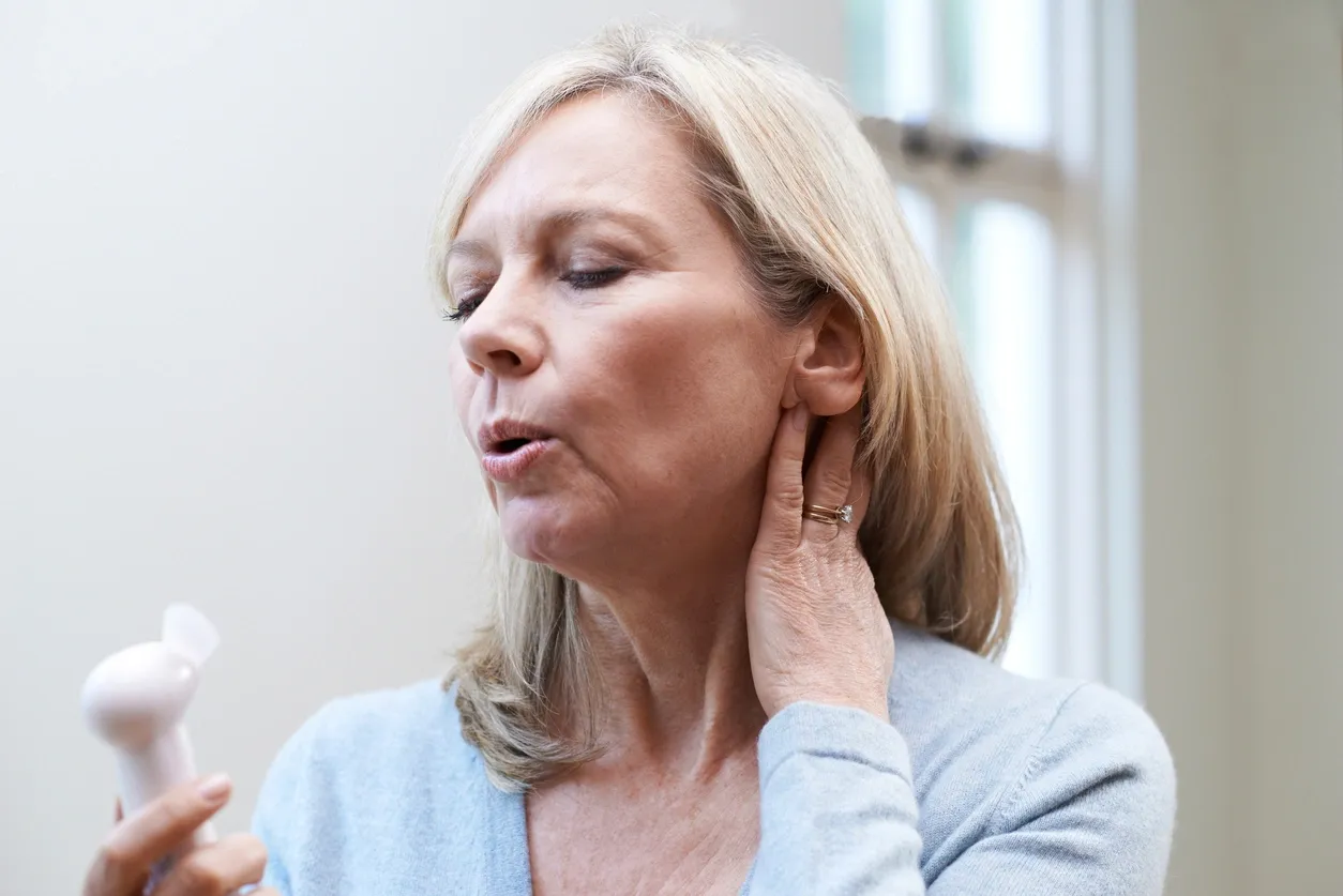 Woman practicing mindful breathing to support emotional balance during menopause