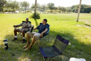 Men sitting outdoors having an open conversation about health and wellbeing